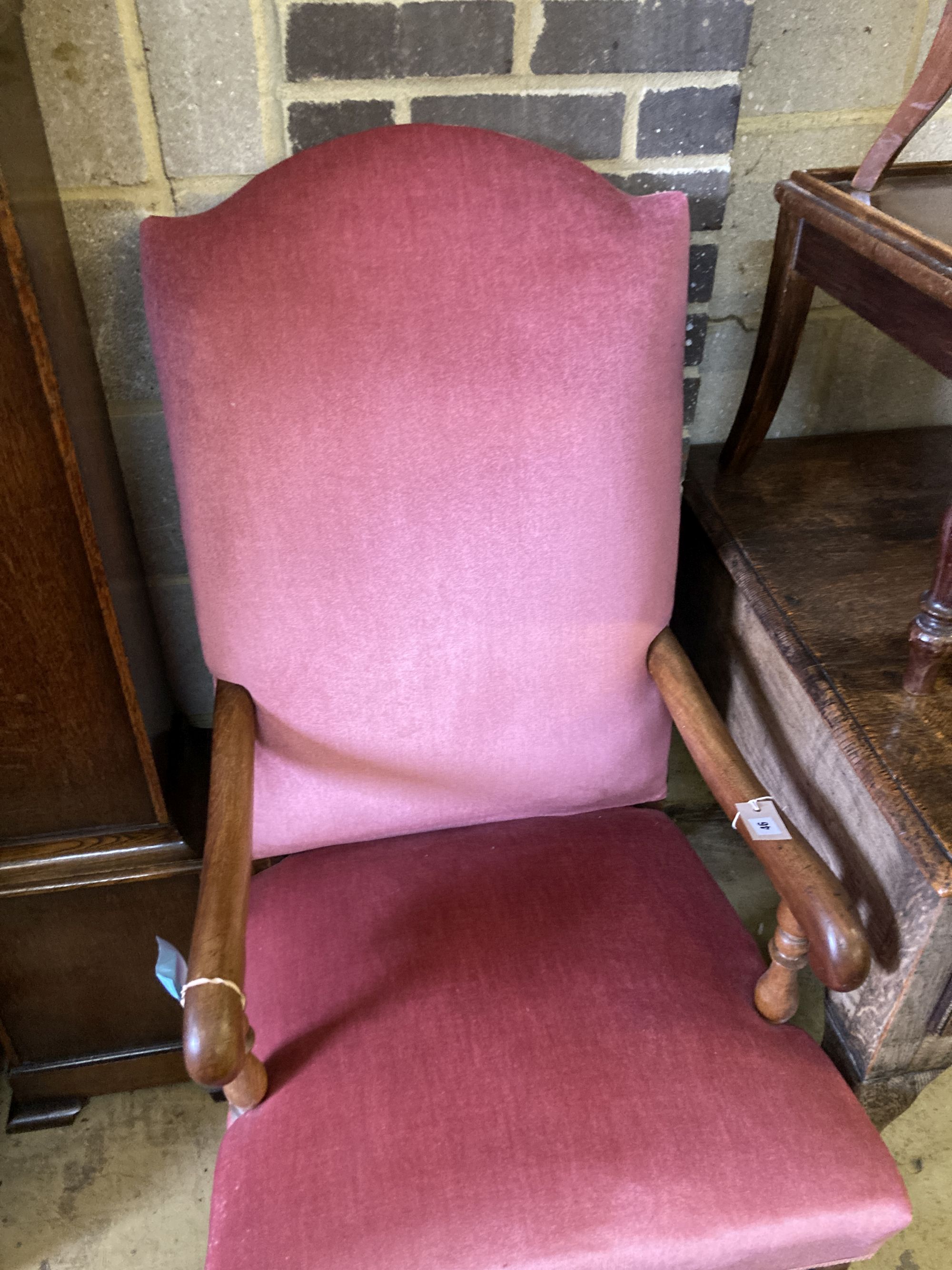A walnut upholstered elbow chair, circa 1700